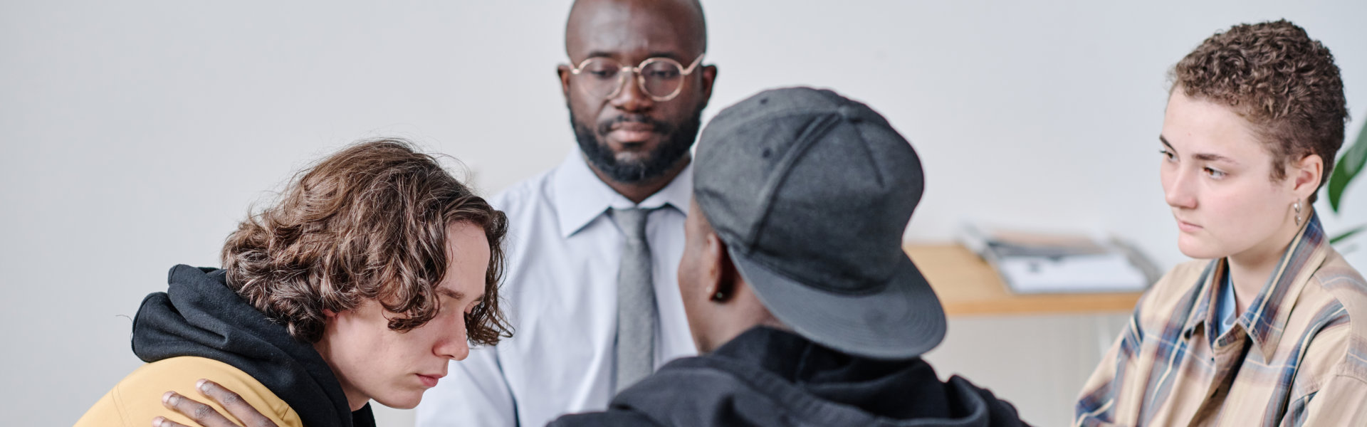 A group of people talking to each other